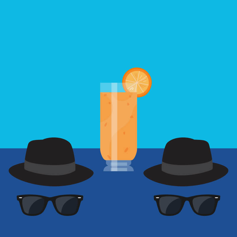 Blue background with tall orange cocktail, two fedora hats and two sets of sunglasses