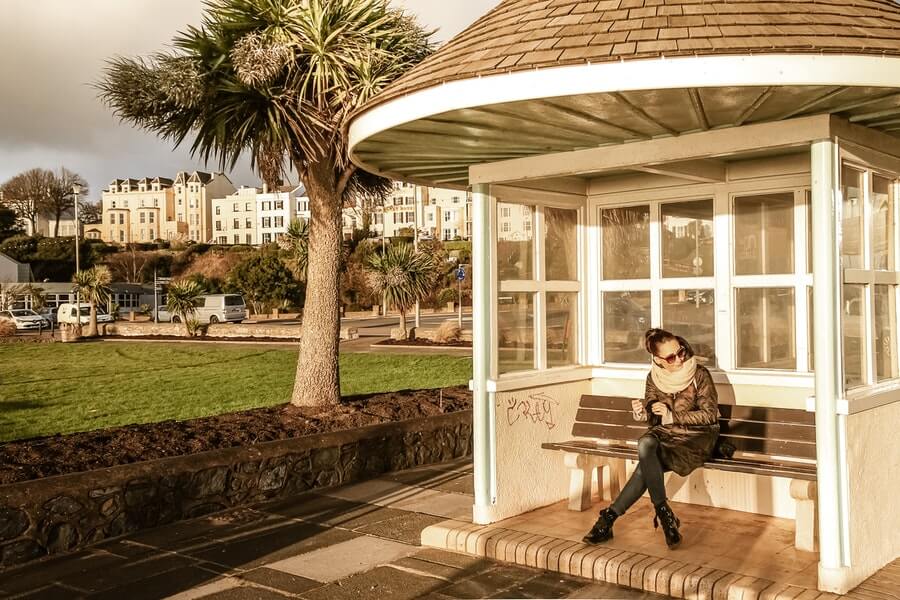 woman sitting in summer house