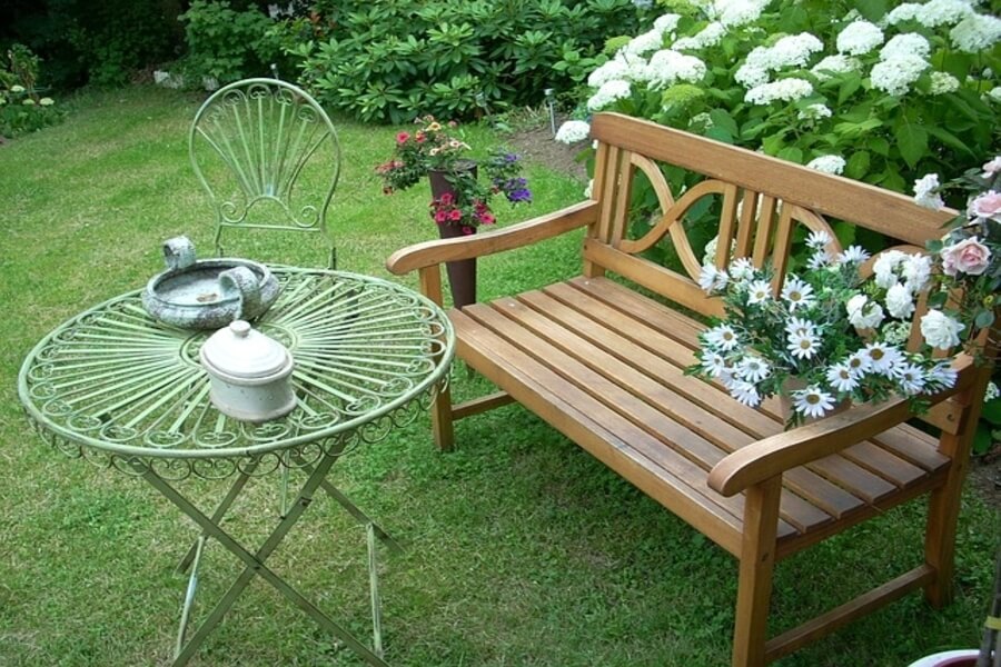 wooden garden bench with iron table