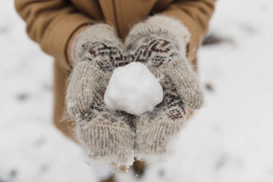 person holding a snowball