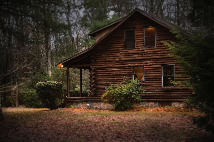 finished log cabin in woods